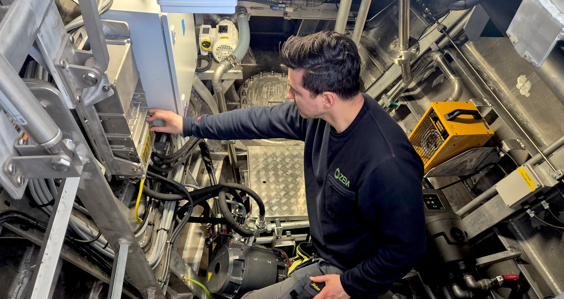 A ZEM service engineer working in a vessel engine room